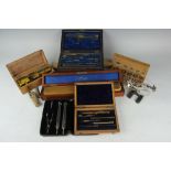 A mahogany cased box of Stanley rulers, various sizes, with a lacquered brass travelling microscope,