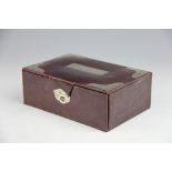 A silver mounted Asprey jewellery box, leather covered and with silver set corners, London 1912,