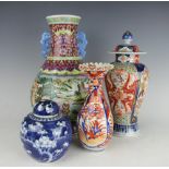 A famille juane baluster vase, 31cm high, an Imari high shouldered vase and cover, 27cm high,