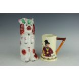 A Staffordshire jug in the form of a begging spaniel, with russett patched decoration,