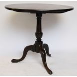 A George III mahogany tilt top occasional table, with one piece circular top,