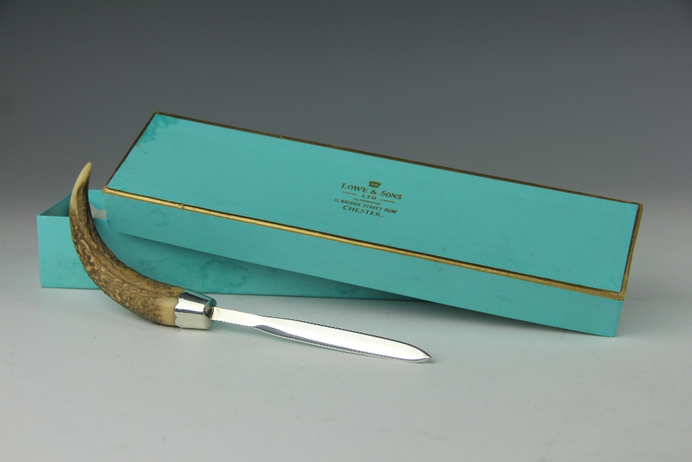 A desk or letter knife, the silver blade London 1985 with antler handle, 21.