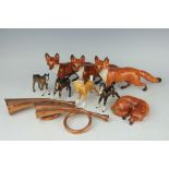 A collection of Beswick to include; three foxes standing, 13cm high, one fox curled, 10cm wide,