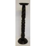 A mahogany torchere / jardiniere stand, with turned and spiral fluted column,
