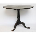 A George III oak tripod table, of large proportions, with four plank top,