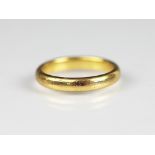 A 22ct yellow gold wedding band, weight 4.