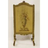 A late 19th century French carved giltwood and gesso fire screen, in Louis 16th style,