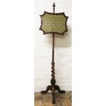 A William IV carved rosewood pole screen, on tripod base with scroll feet,