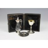 A Victorian cased miniature silver communion set, Elkington & Co London 1888, comprising; chalice 7.