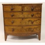 A George III mahogany bow front chest, of two short and three long drawers, on splayed bracket feet,