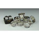 A set of three leaf embossed silver napkin rings,