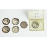 A William III shilling, 1695, with two Queen Anne shillings, 1708,