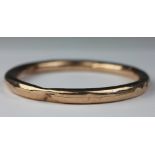 A 9ct yellow gold slave bangle, Smith and Pepper, Birmingham 1924, weight 14.