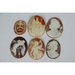 A collection of six carved shell cameos, each oval disc depicting a different view,