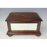 An Edwardian inlaid mahogany box, with mirror panel sides, on bun feet,