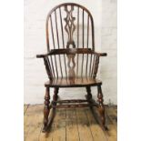 A modern beech Windsor rocking chair, with turned frame,