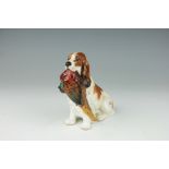 A Royal Doulton model of a seated spaniel with pheasant, HN1028,