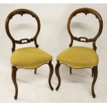 A set of six Victorian carved walnut dining chairs,