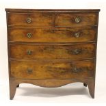 A George III mahogany bow front chest, of two short and three graduated long drawers,