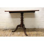 A George III mahogany occasional table, with rectangular top, on a turned column and tripod base,