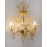 LAMPADARIO a sei luci in vetro Murano con coppette bianco e oro. XX secolo Misure: h cm 110