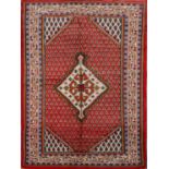 TAPPETO Wiss, trama e ordito in cotone, vello in lana. Persia XX secolo Misure: cm 205 x 130