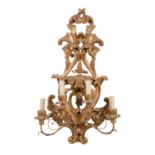 APPLIQUE a quattro luci in legno dorato. Firenze primi '900 Misure: cm 67 x 41