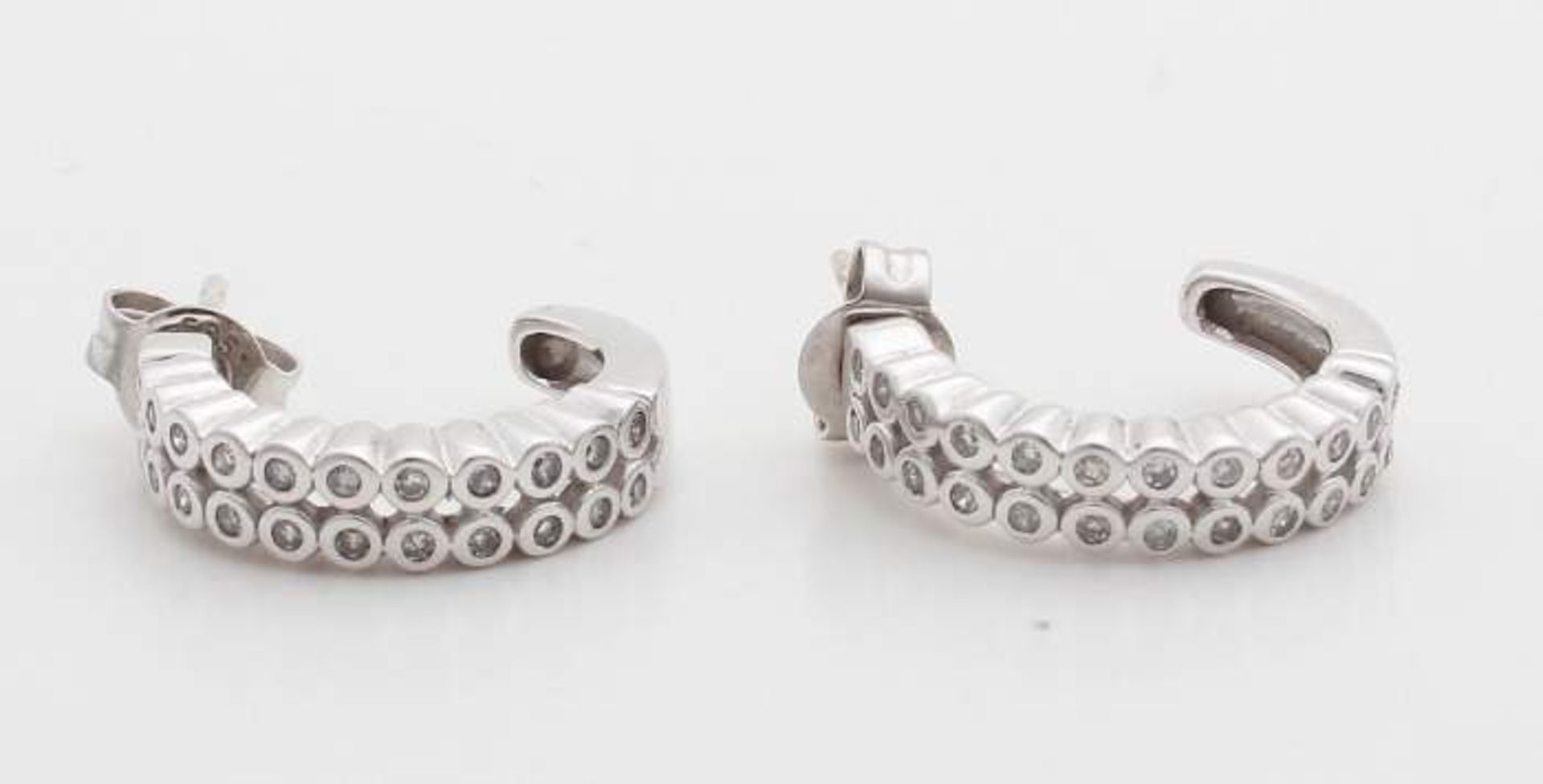 White gold earrings, 585/000, with brilliants. Creoles with two rows of small smooth conversions set