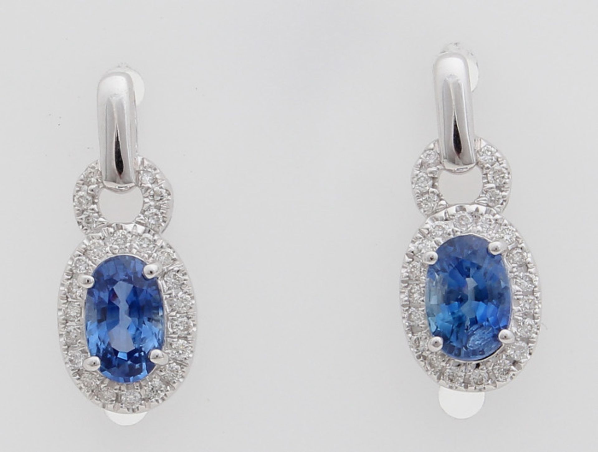 Elegant earrings, WG 750/000 with diamond and blue sapphire. Earrings with oval rose with a blue