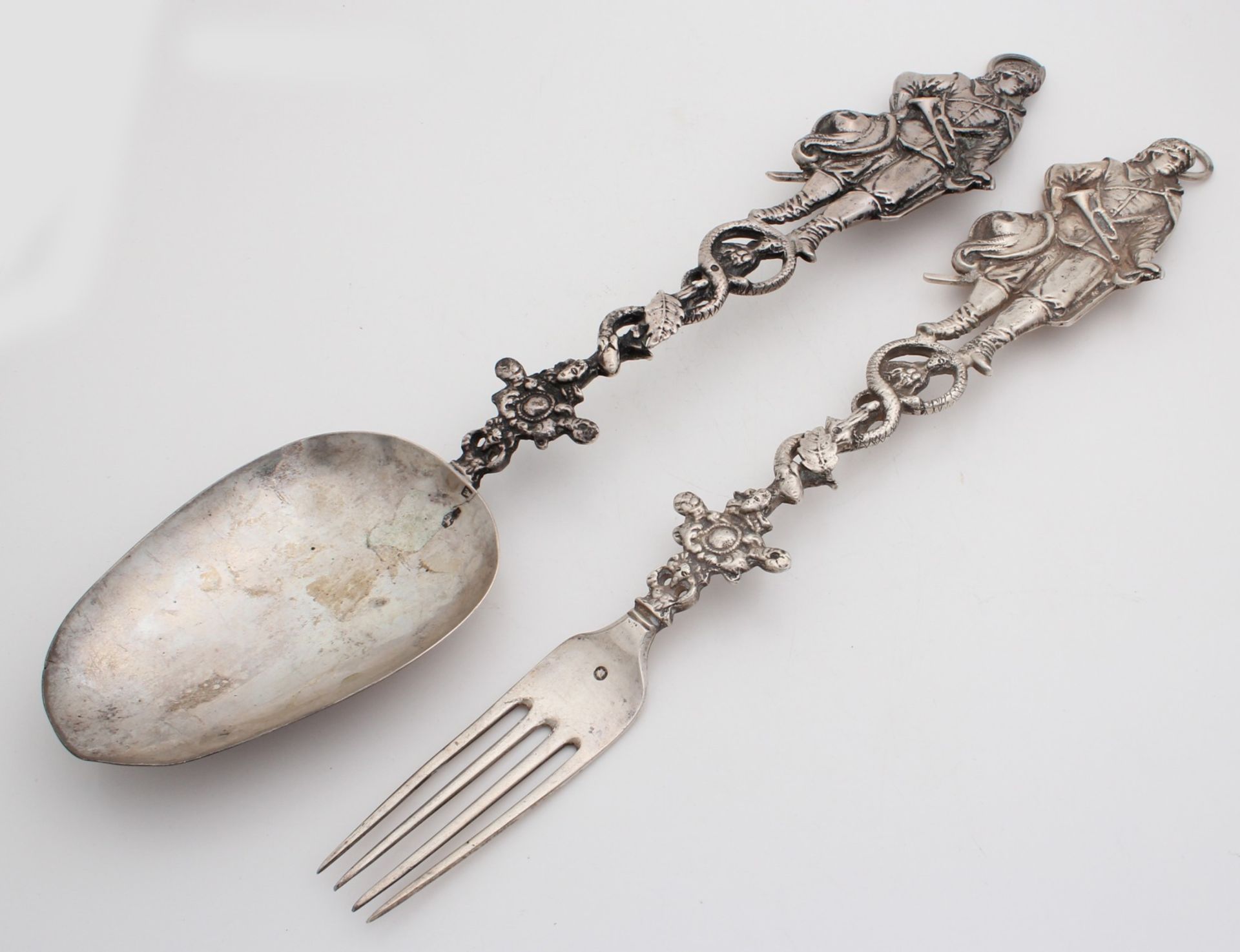 Beautiful silver fork and spoon, 835/000, with figure. Large spoon and fork with richly carved