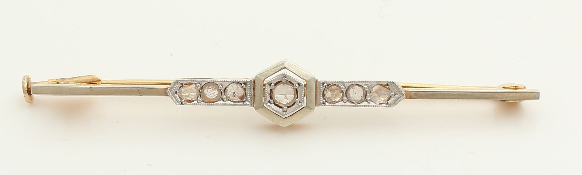 Gold bar brooch, 585/000, with diamond. Art Deco brooch with seven diamonds, put in white gold. Some