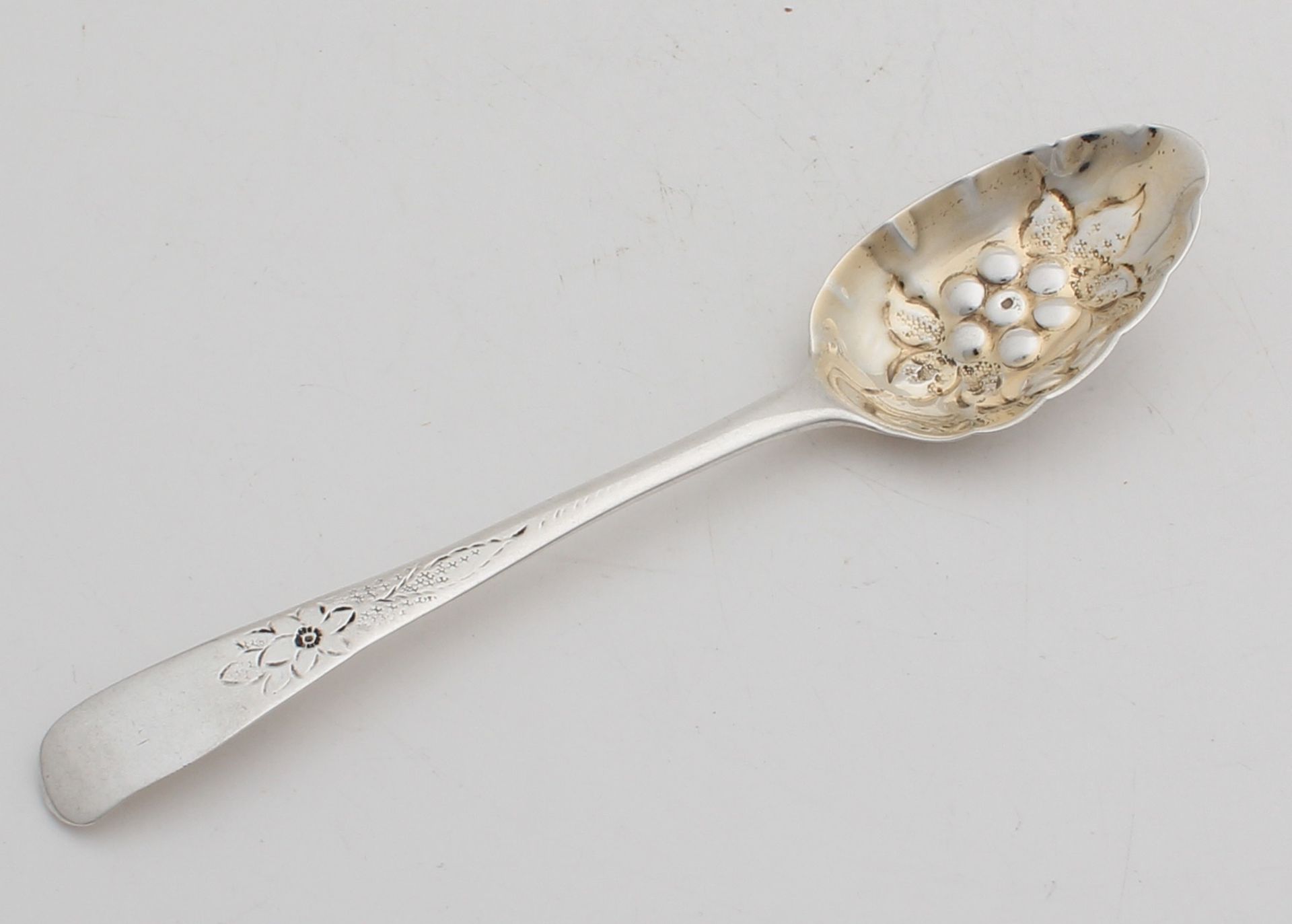 Rare antique silver strawberry spoon, 925/000, with chased gilt bowl and the stem features a