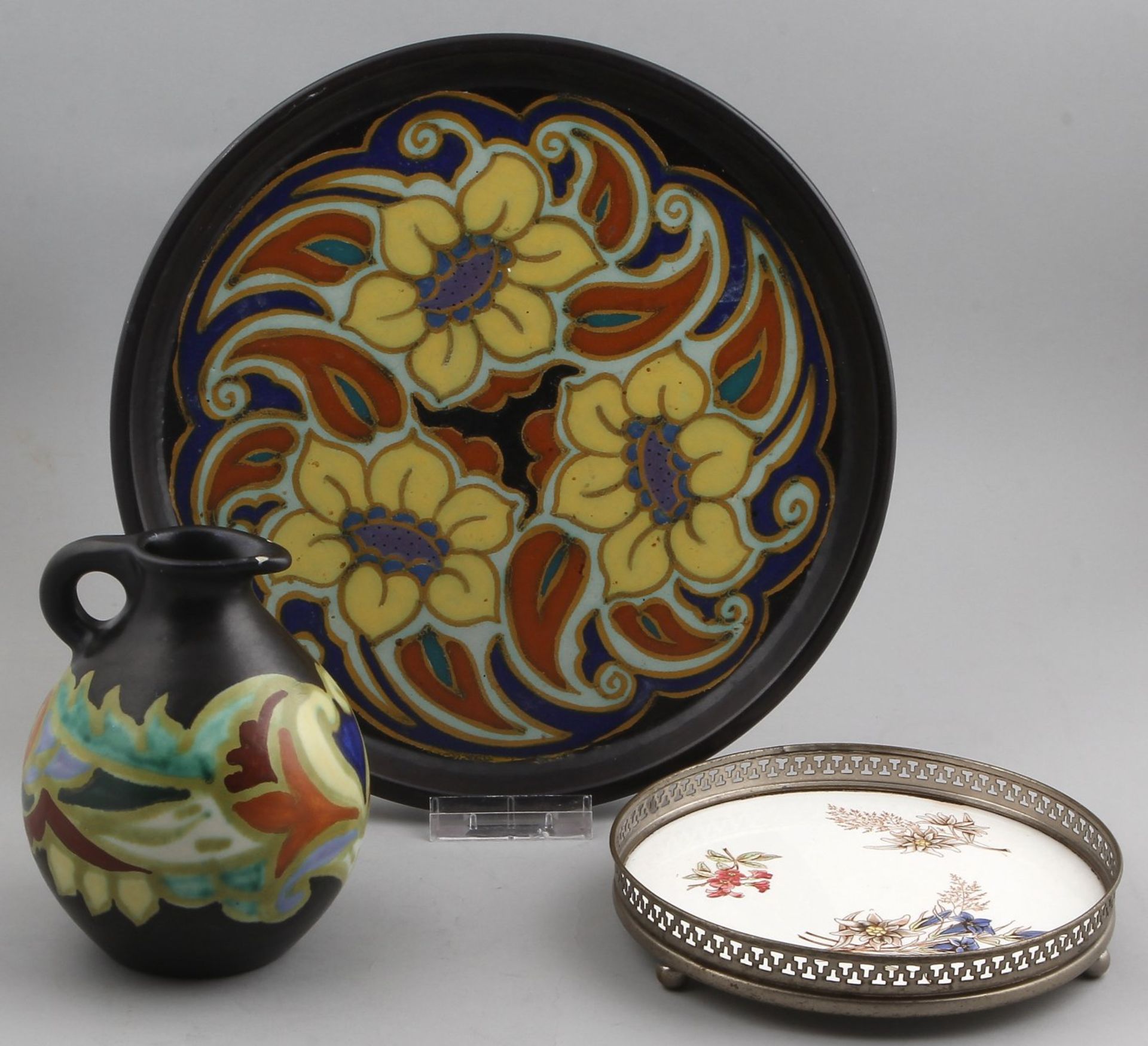 Three parts antique pottery, circa 1900, covers to jug (chips spout), round tablet Arnhem pottery,