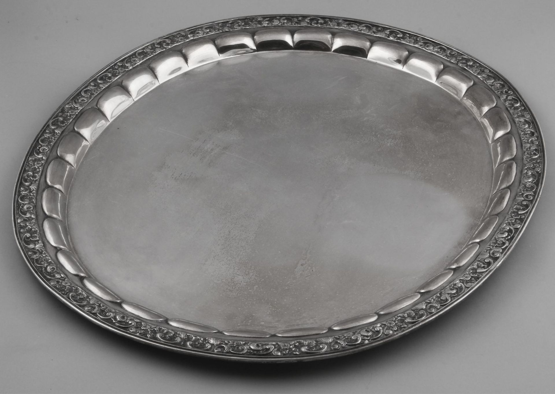 Especially silver tray, 800/000, German. Large oval tray with scalloped inner edge, decorated with a