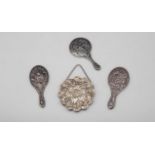Silver Mirrors - 4 Pieces Collection of 4 silver hand held mirrors, decorated with relief floral