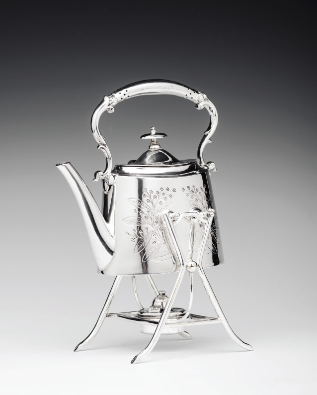 Spirit Kettle British, 20th century, silver-plated metal teapot and stand with heater. Stamped and