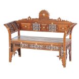 Ottoman Settee Ottoman, 19th century, carved walnut inlaid with mother of pearl winged settee.