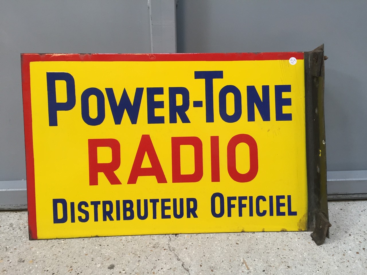 « POWER-TONE RADIO », Panneau publicitaire en tôle émaillée. Double face. Quelques légers manques.