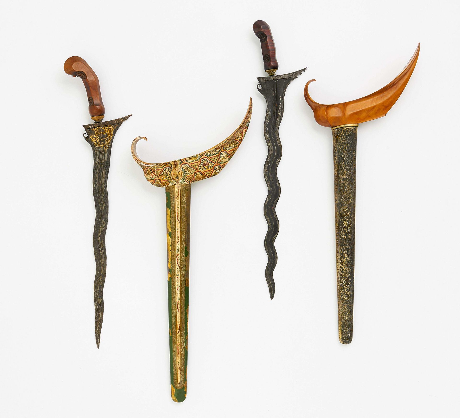 TWO KERIS WITH LADRANG SHEATS. Indonesia. Forged. A) Surakarta with gold painting of a Nandi on