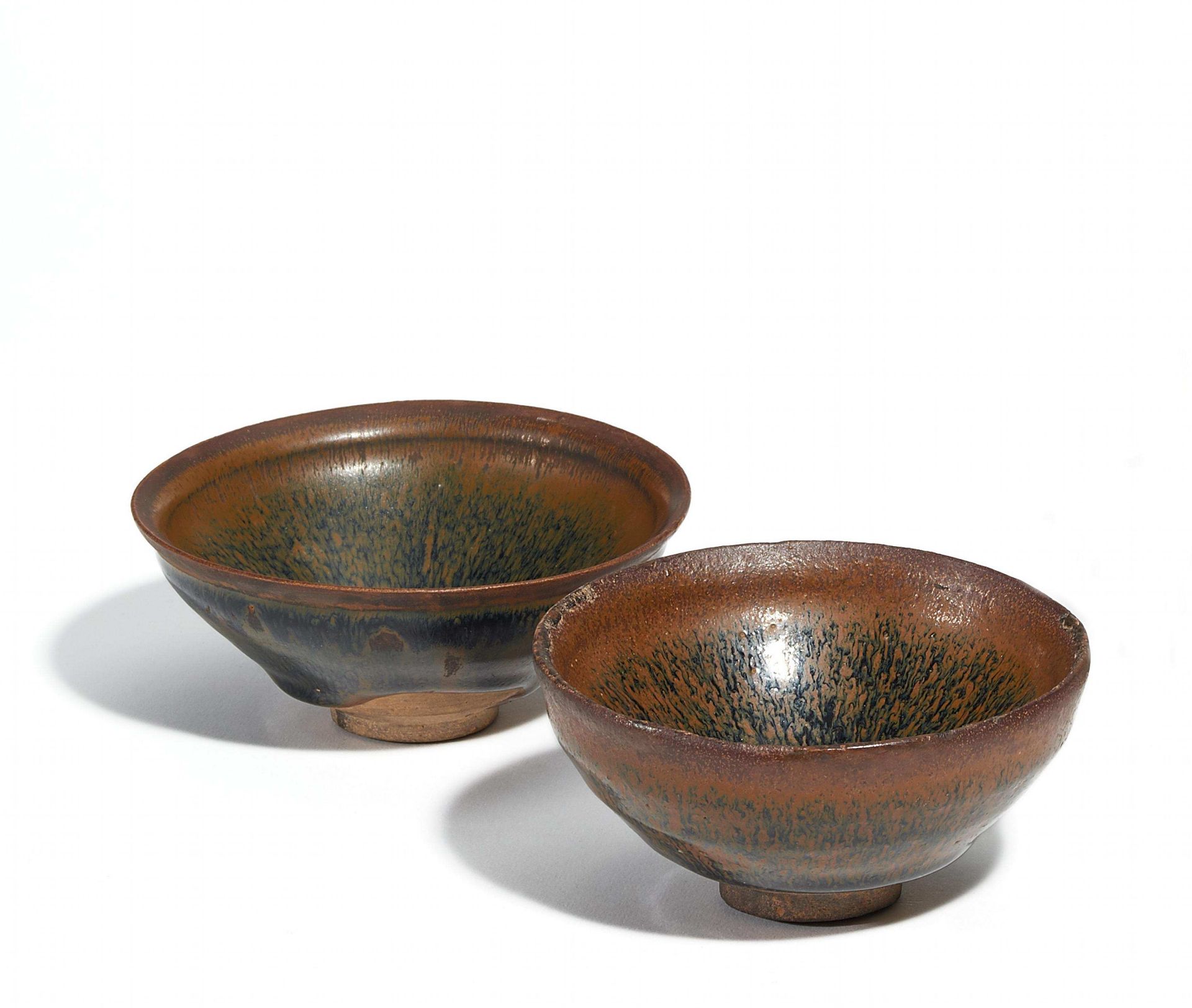 TWO JIANYAO TEA BOWLS. China. Probably Song-Dynasty (960-1279). Ceramic fired at high temperature
