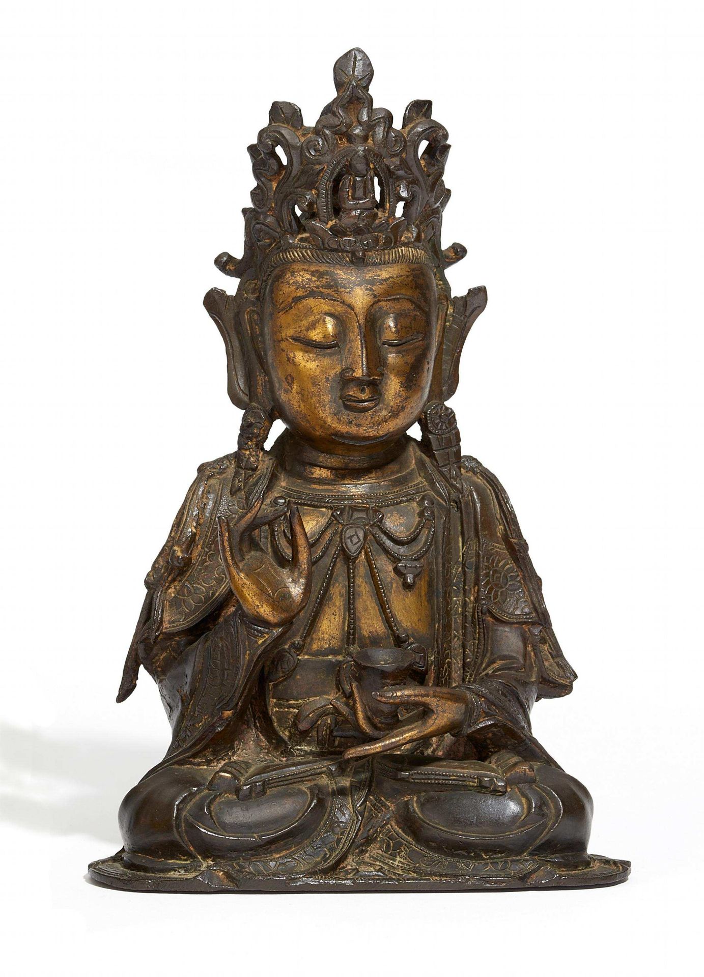 CROWNED AVALOKITESHVARA. China. Ming-Dynasty (1368-1644). Bronze with dark patina and gilding. The