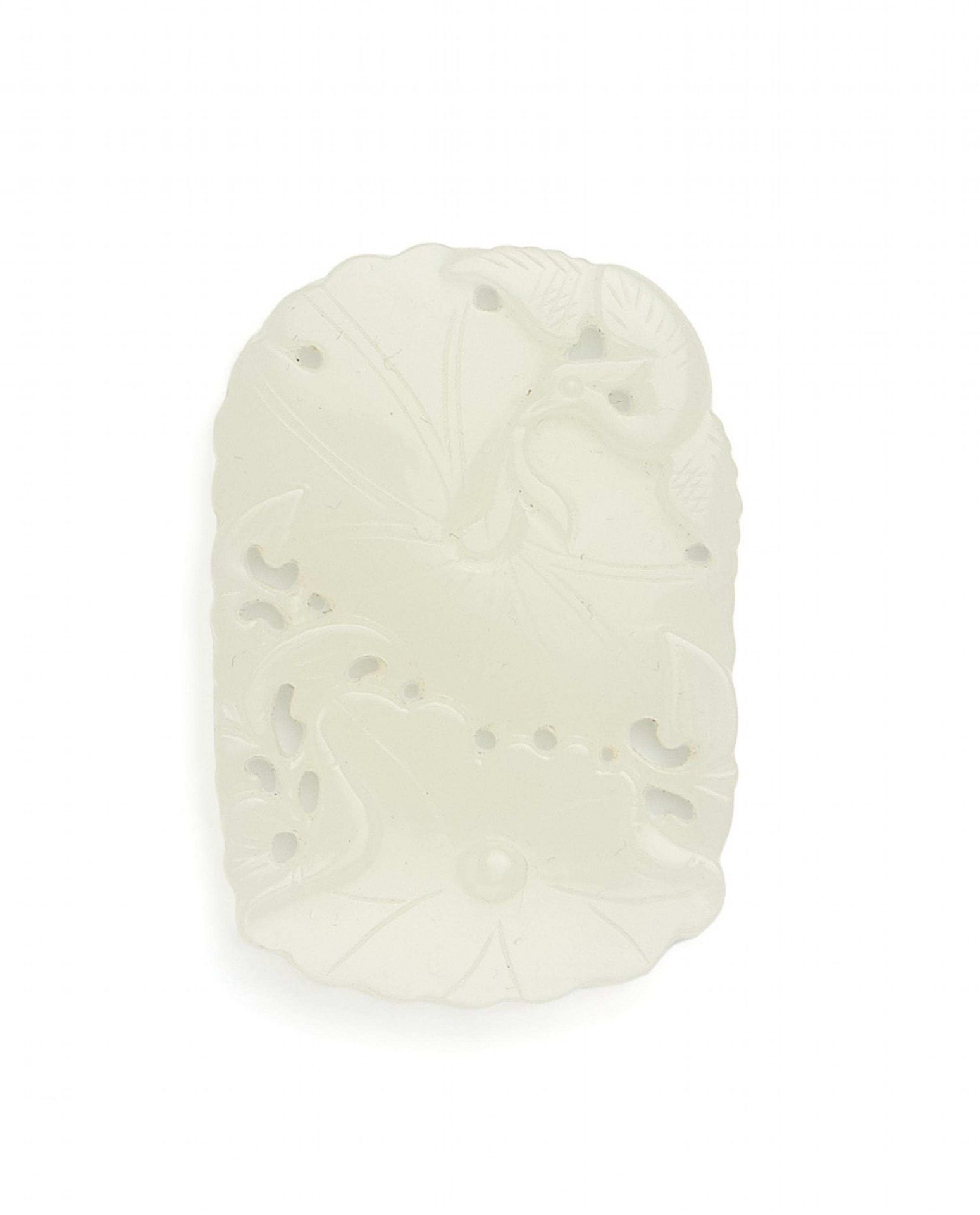 PENDANT WITH LOTUS. China. Even, nearly white jade. Flat, rounded rectangular shape. Both lotus