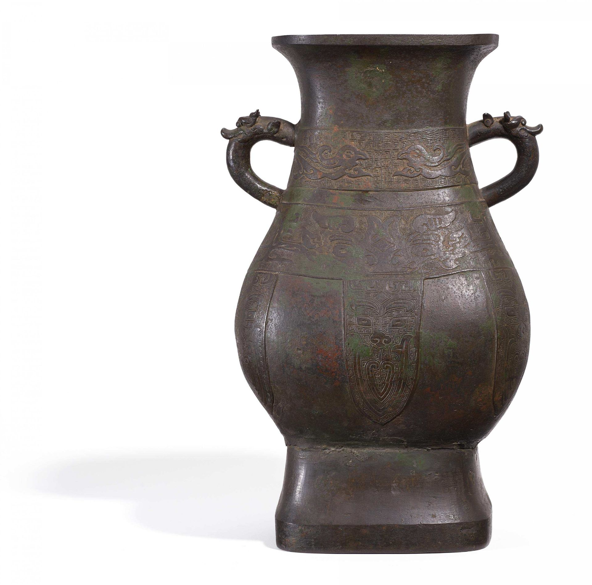 WINE VESSEL FANG HU WITH DRAGON HANDLES. China. Probably Song dynasty (960-1279). Bronze with green,