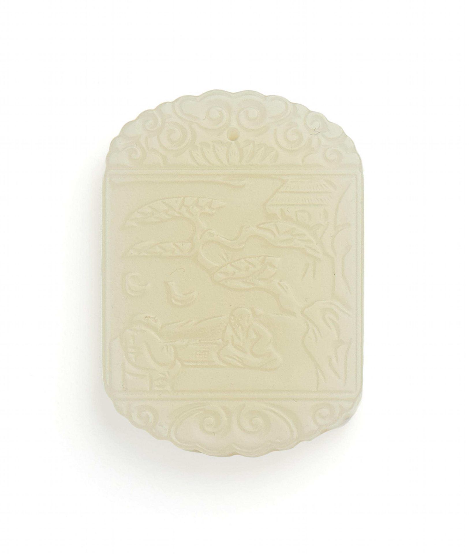 PENDANT WITH LOW RELIEF. China. Greenish white jade. Rectangular, top and bottom rounded. On each