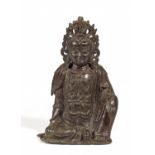 SITZENDE GUANYIN. China. Ming-Dynastie. 15./16. Jh. Bronze mit dunkler Patina. In lalitâsana mit der