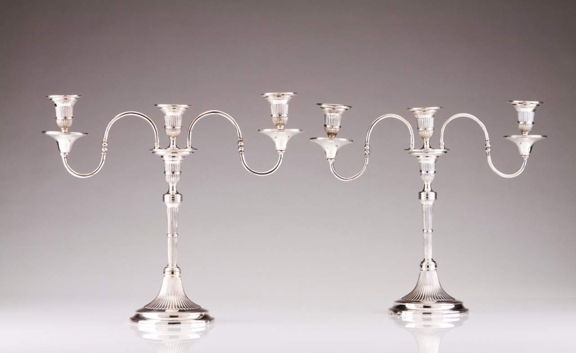 A pair of D. Maria (1777-1816) three-light candelabra Portuguese silver Fluted decoration with plain