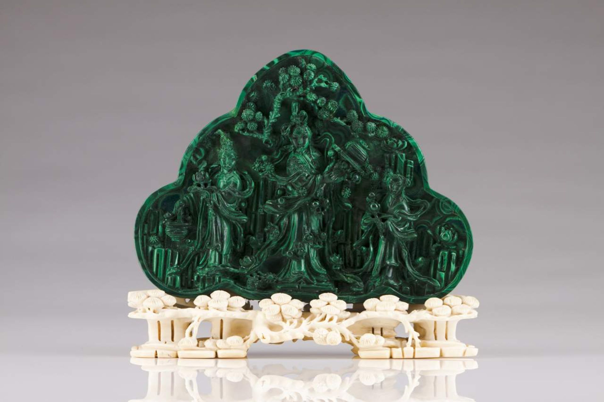 Oriental divinities Malachite plaque with carved ivory base China, 20th century 17x20 cm