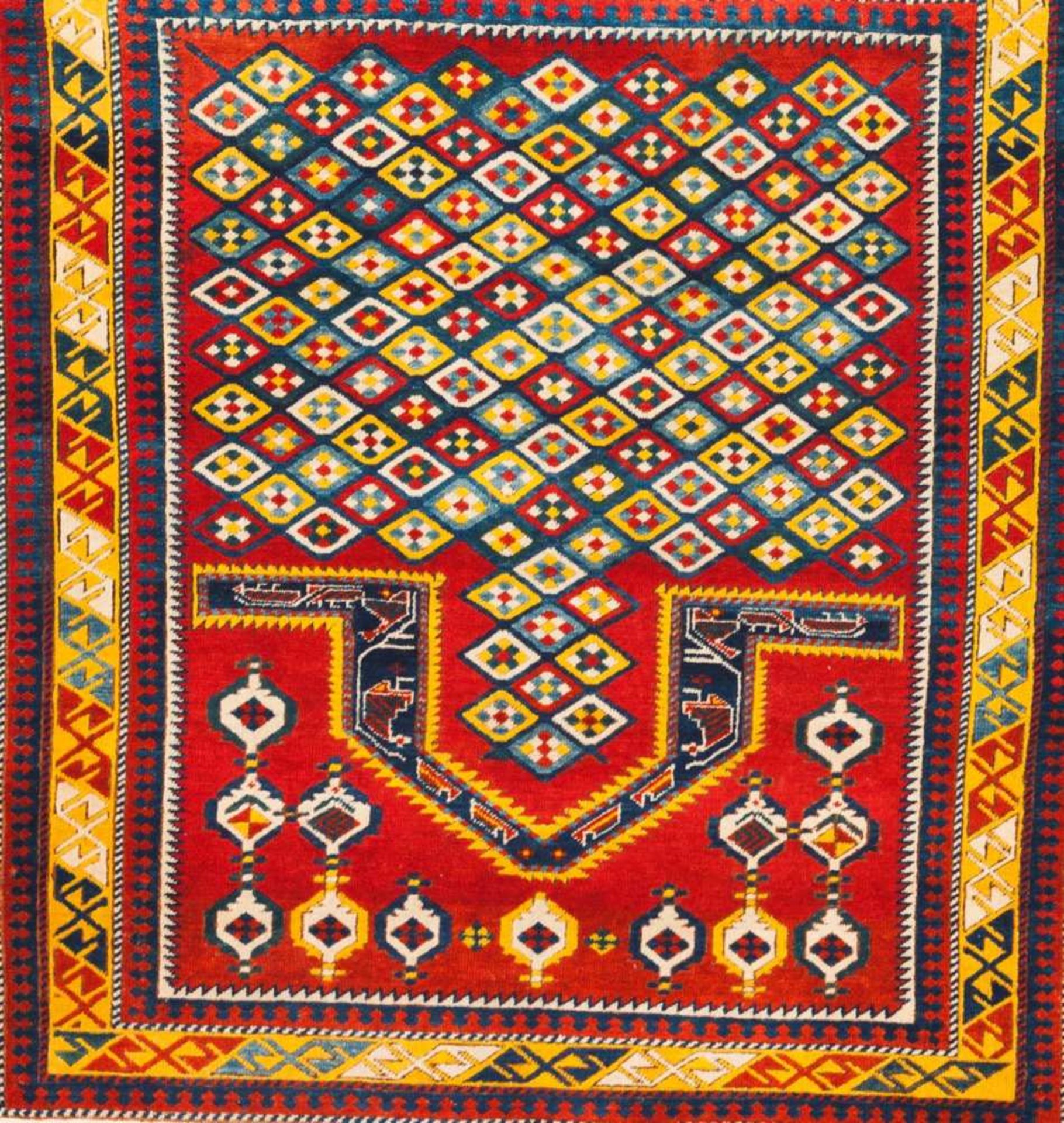 A Kazak design praying carpet Cotton and wool Blue, yellow, white and red decoration Pakistan