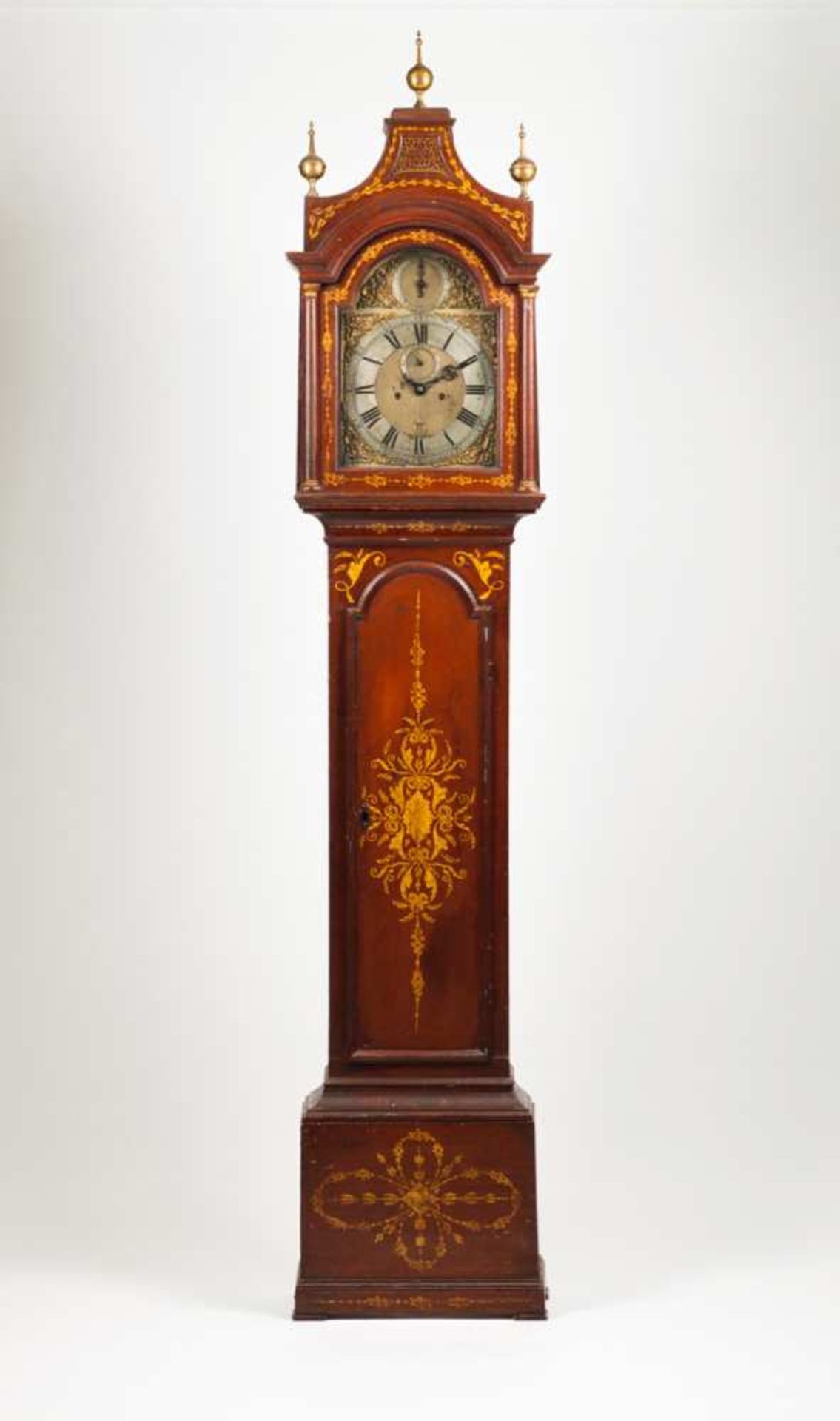 A long case clock Red lacquered wood with gilt decoration depicting floral motifs Gilt metal dial