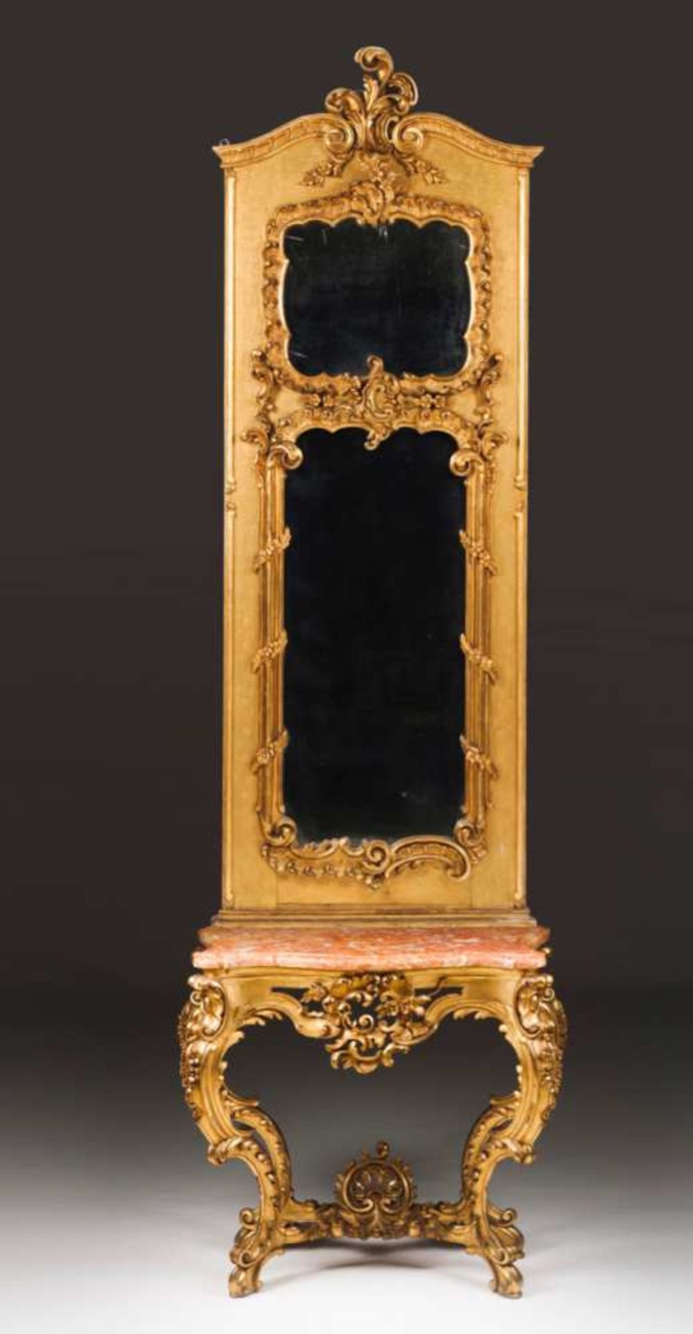 A Louis XV style pier table and mirror Carved and gilt wood decorated with strapwork, scrolls and